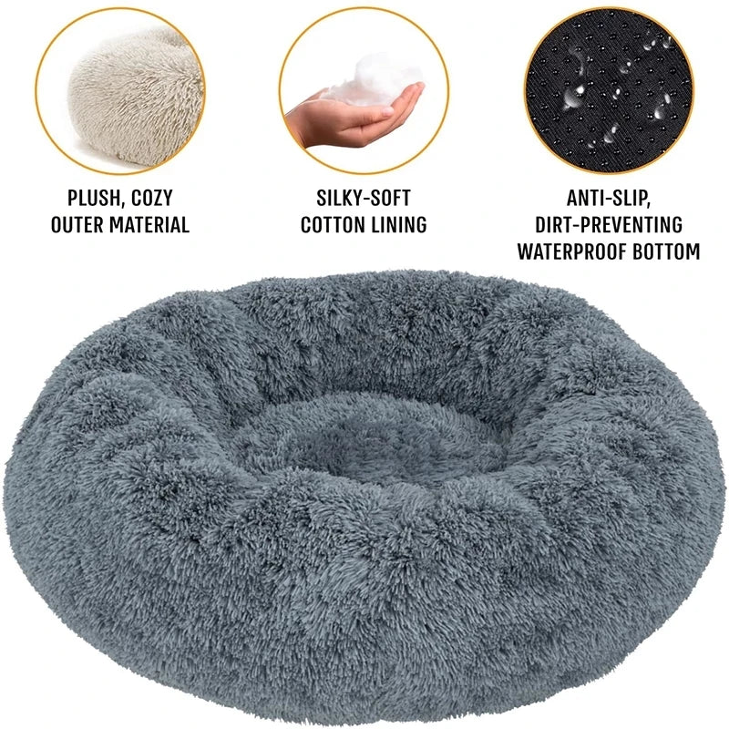 A round, gray, fluffy pet bed with a thick, soft outer material and a waterproof bottom.
