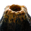 Close-up view of a porous, yellowish-brown bubble stone decoration used for aquarium decor.