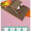 A yellow and orange bird is perched on a brown corrugated cardboard perch stand with various chew toys.