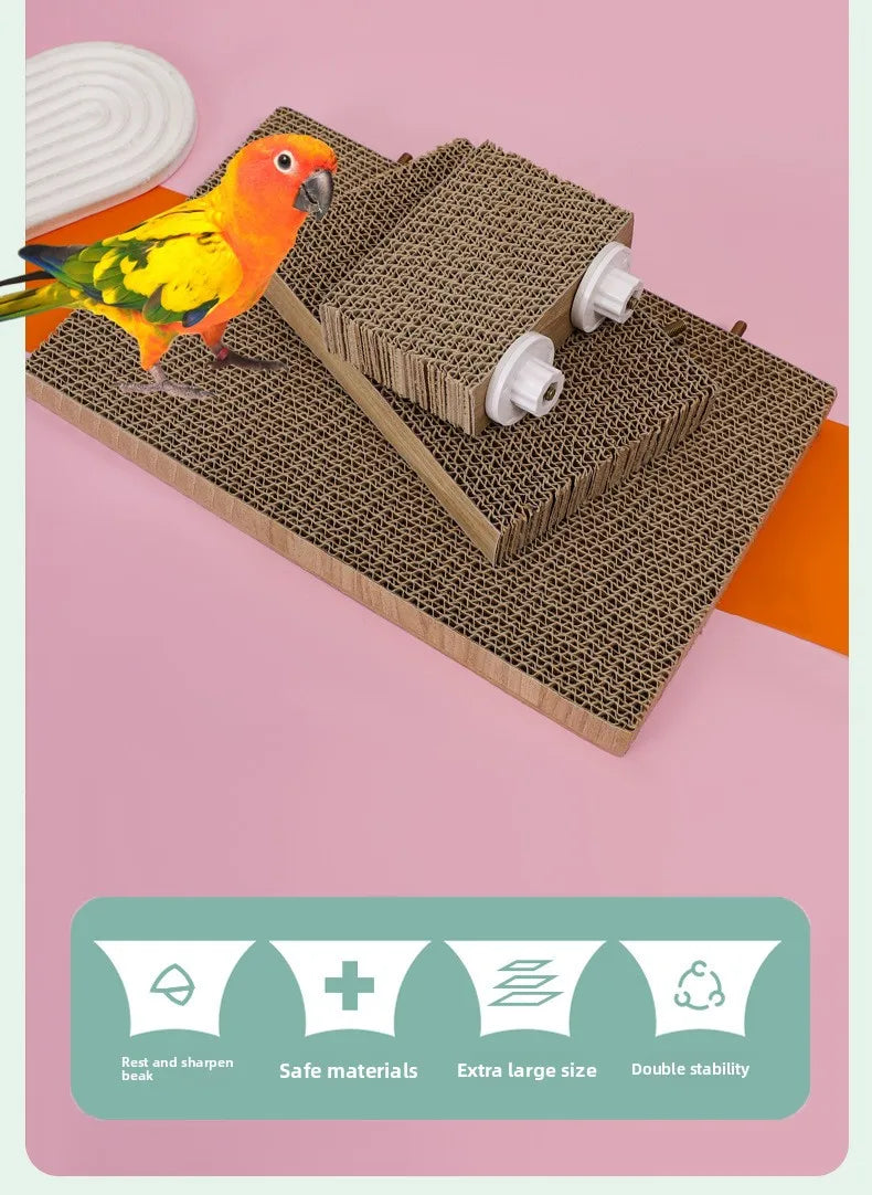 A yellow and orange bird is perched on a brown corrugated cardboard perch stand with various chew toys.