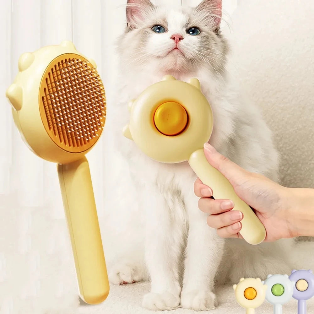 A cat is holding a yellow pet hair removal slicker brush for grooming.