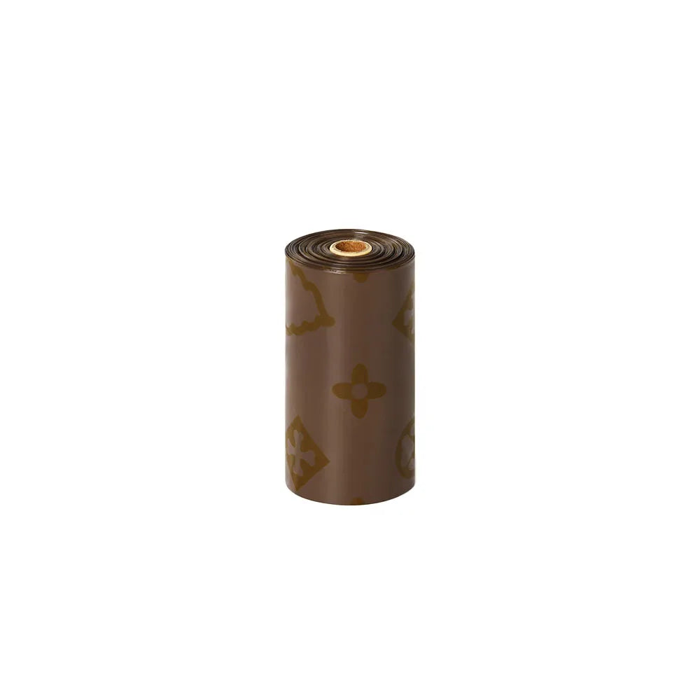 A roll of biodegradable scented dog poop bags in a brown color.