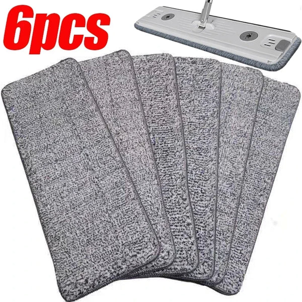 Six reusable gray microfiber mop pads and a cleaning tool are shown.