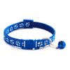 Blue pet collar with white cartoon footprints and a bell attached.