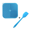 A blue silicone licking mat for dogs and cats with suction cups and a matching blue spoon.