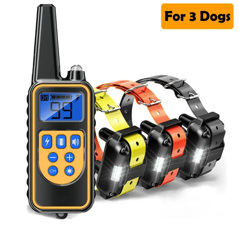 A black remote dog training collar with an LCD display is shown next to three orange and yellow dog collars.