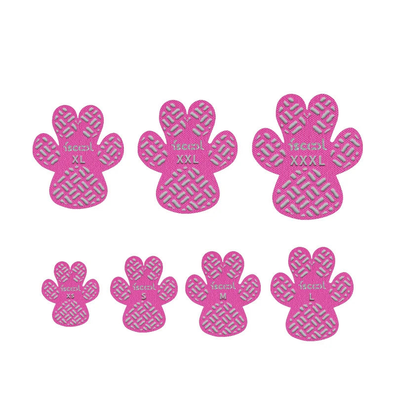 A pack of four pink dog anti-slip paw grips in various sizes, including small to extra-large.
