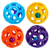 Four colorful natural rubber dog chew balls in blue, yellow, orange, and purple.
