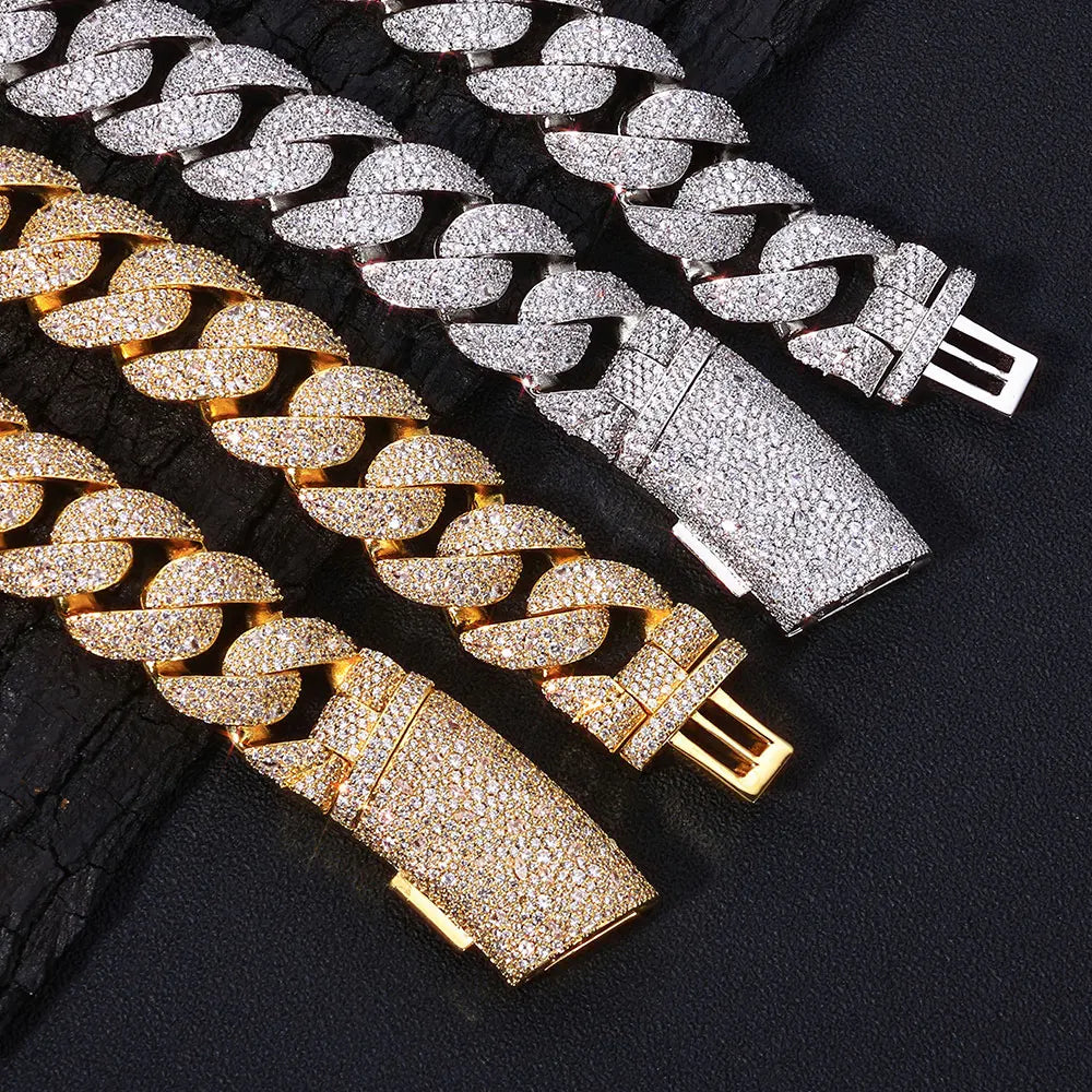 A display of rose gold and silver plated curved flip buckle Cuban link necklaces.