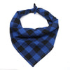 A navy blue and black plaid cotton dog bandana folded around the neck.