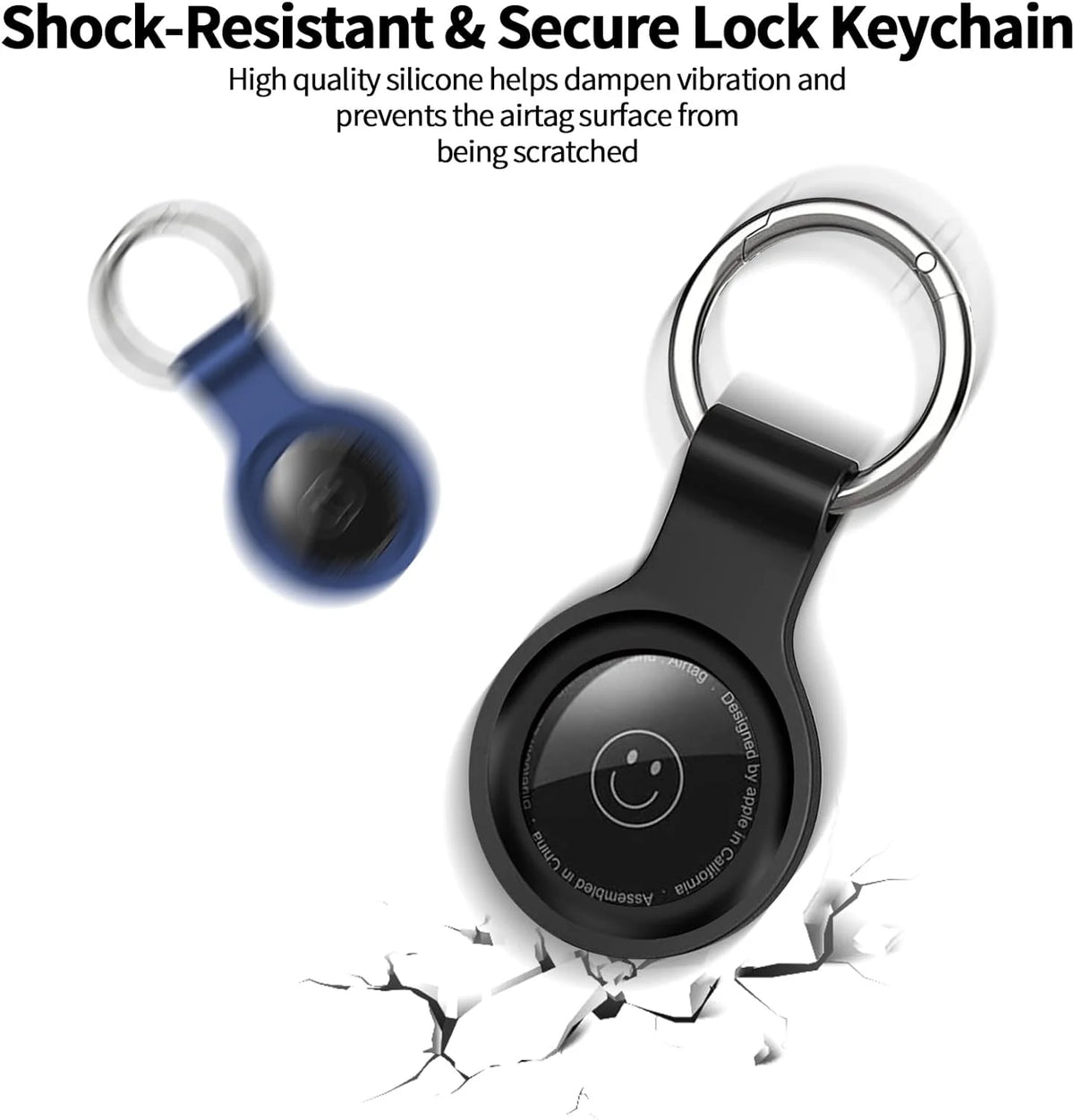 A black silicone airtag protective cover attached to a silver keychain, shown with cracked surface below.