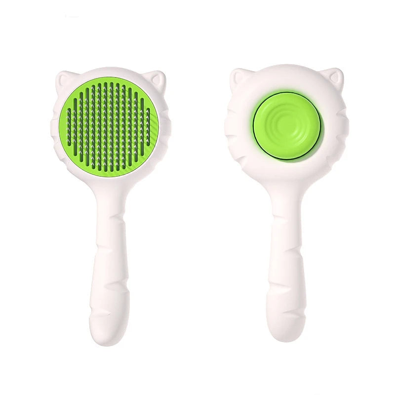 A white pet deshedding brush for cats and dogs with a bright green bristled head.