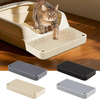 A cat is stepping onto a litter box ramp step, with various plastic ramps and trays shown below.