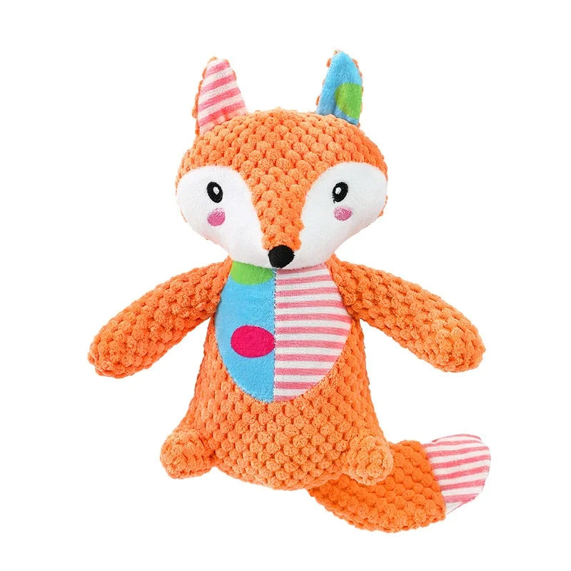 An orange plush toy resembling a fox with pink and blue accents.