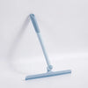 A light blue 360° rotating shower squeegee with a silicone holder against a white background.