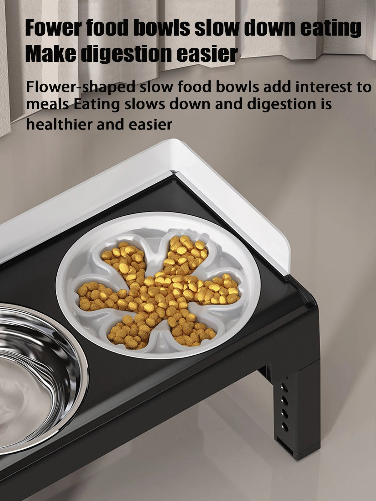 A black elevated dog feeder with two stainless steel bowls filled with yellow kibble.