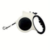 A white illuminated retractable dog leash with a black housing and reflective nylon cord.
