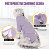 A cat wearing a purple postoperative clothing vest with an adjusting buckle and back velcro for comfort