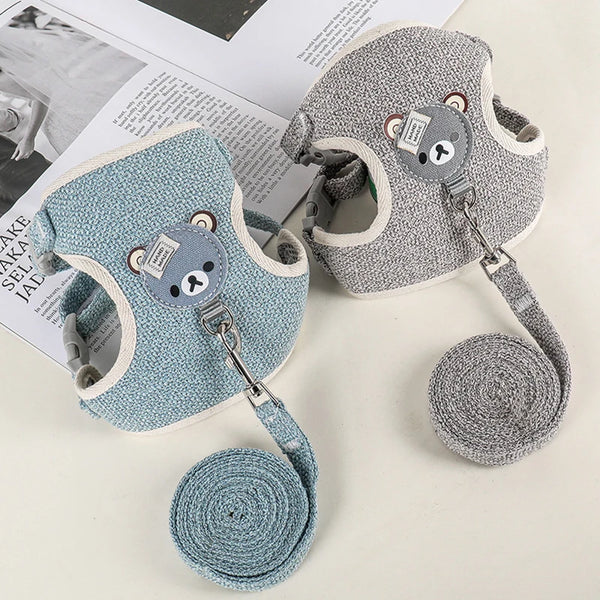 A gray padded rabbit harness and leash set with a matching rolled-up leash shown on a white background.