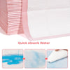 Pink super absorbent dog pee pads demonstrating quick water absorption and leak-proof protection