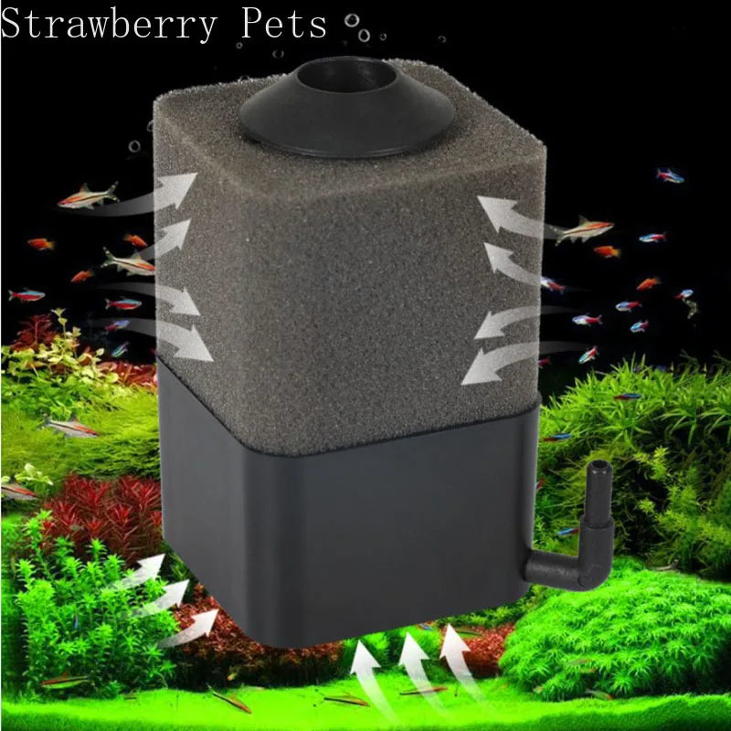 A black aquarium bio sponge filter with an air pump connection is shown in a natural, green environment.