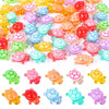 A collection of colorful luminous resin turtle ornaments in various shades and sizes for home decor.