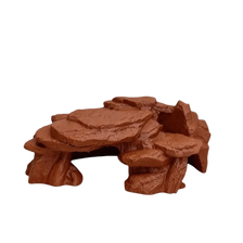 A realistic 3D printed ornament depicting a rockery of fish tank rocks.