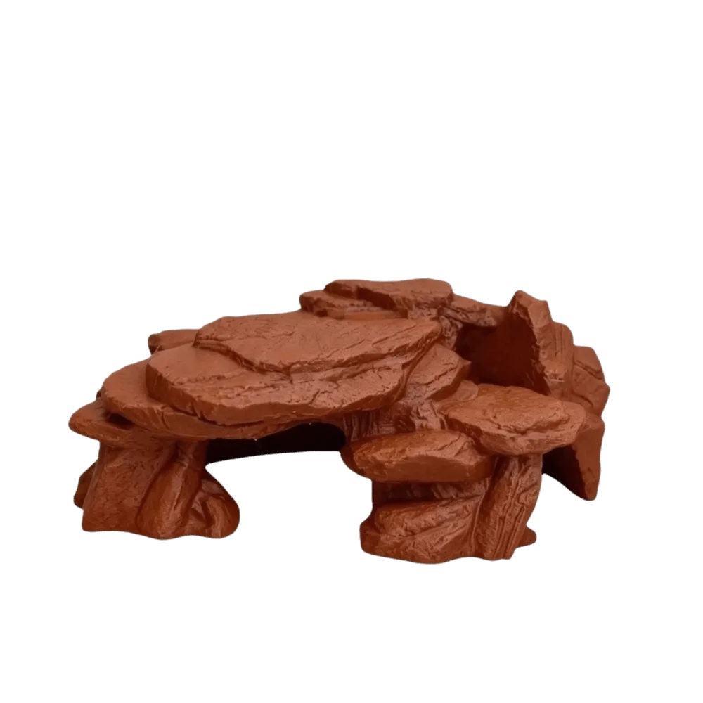 A realistic 3D printed ornament depicting a rockery of fish tank rocks.