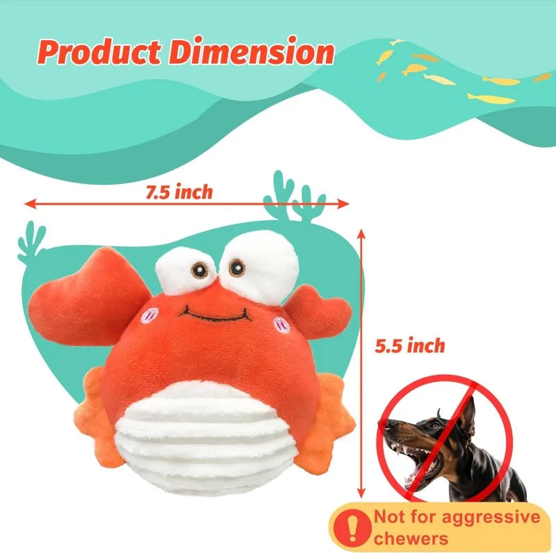 An orange and white plush crab toy with a smiling face is shown next to dimension markings.