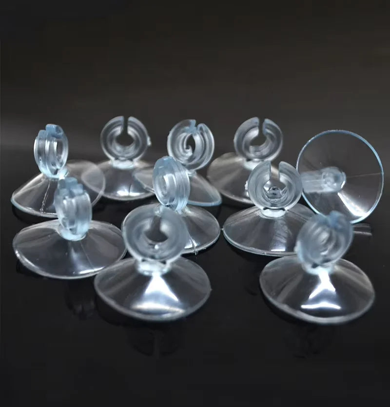 A pack of ten clear silicone suction cup air tube holders for aquariums.