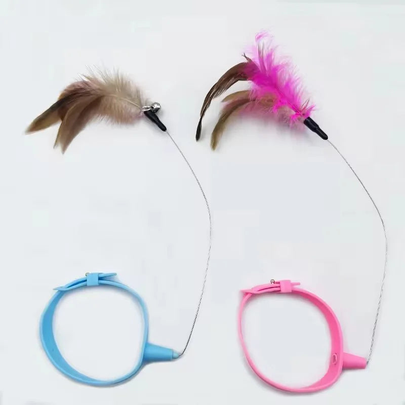 A pair of feather cat teaser wands, one brown and one pink, with a bell.