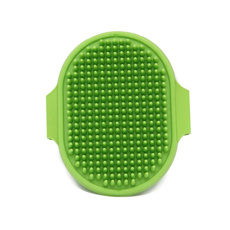 A bright green, oval-shaped soft rubber pet grooming brush with a textured surface.