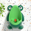Un entrenador para el entrenamiento de ir al baño en forma de rana verde brillante con un pequeño detalle de hoja naranja.