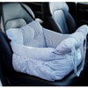 A striped blue and white pet car seat with safety straps is shown inside a dark car interior.