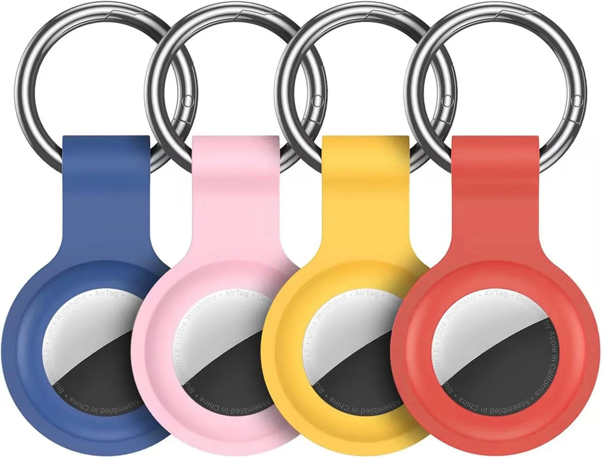 A silicone airtag protective cover in various colors, including blue, pink, yellow, and red, shown with a keychain ring.