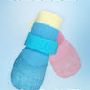 A set of three colorful waterproof anti-slip dog boots in blue, yellow, and pink.