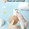 A fluffy gray cat is interacting with a sisal cat catch ball toy resting on a wooden base.