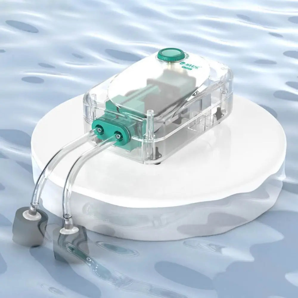 A clear plastic aquarium air pump with adjustable flow is shown resting on a white platform.