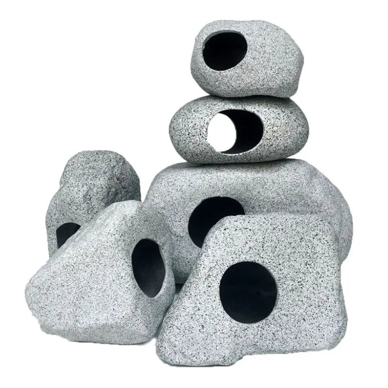 Stack of gray ceramic cichlid cave aquarium decor pieces with natural filtration holes