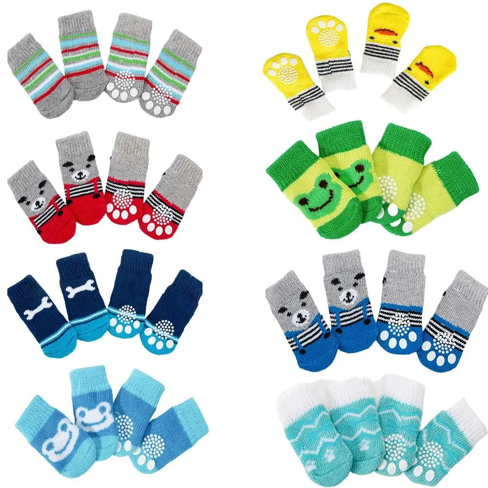 A pack of four anti-slip pet socks in various colors and patterns for dog and cat protection.