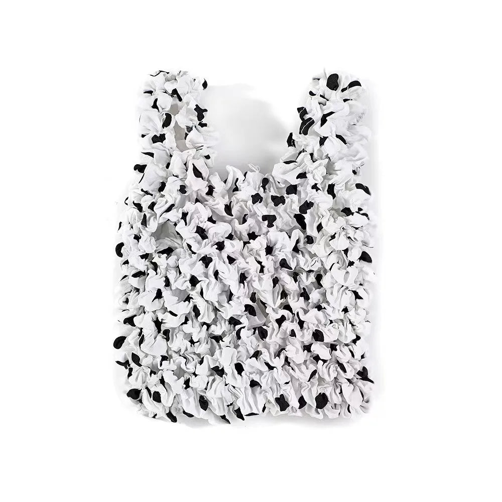 A white reusable foldable bubble shopping bag with a ruffled texture.