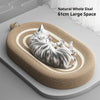 A gray tabby cat is relaxing on a natural woven sisal scratcher board designed for feline wellness.
