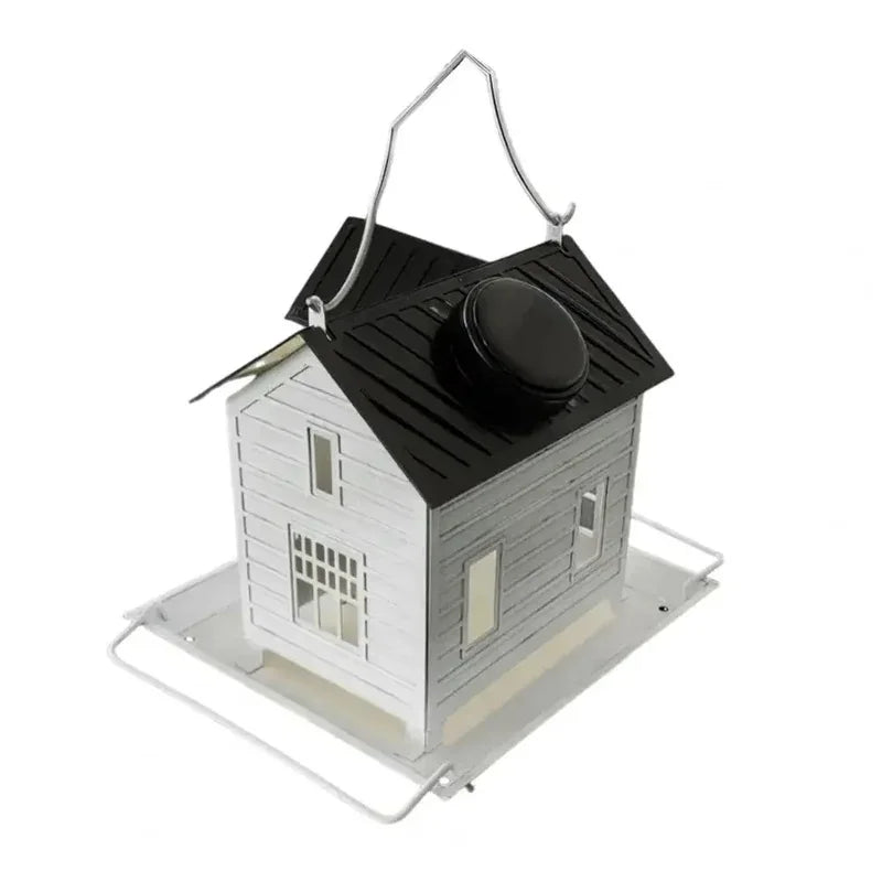 A black solar outdoor bird feeder lantern with a wooden house structure and a metal hanging mechanism.