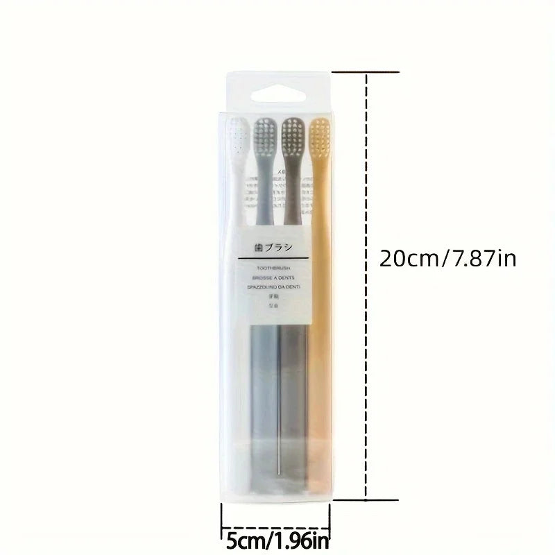 A clear plastic package containing a set of four soft-bristle travel toothbrushes.