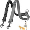 A black and gray dual dog leash attachment with a bungee shock absorber and a yellow dog.
