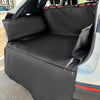 Black durable waterproof dog car seat cover installed in a vehicle interior.