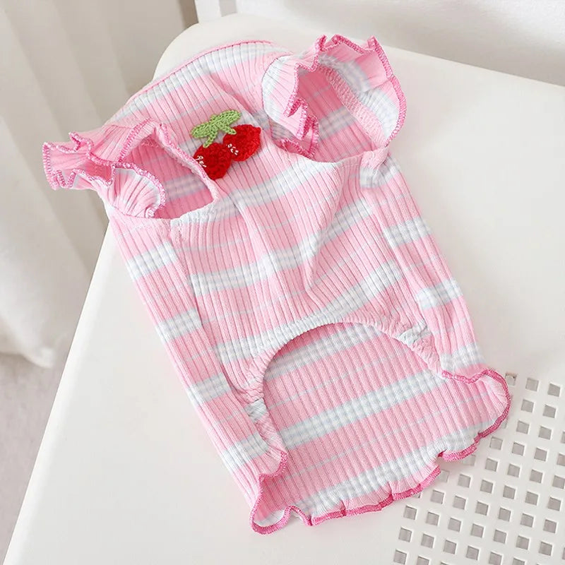 Pink and white striped dog vest with a red strawberry appliqué