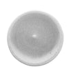 A round, light gray pumice feeder bowl with a textured surface for grinding nails and beaks.