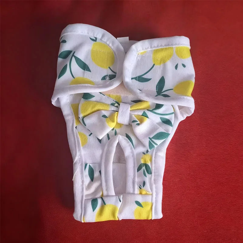 White reusable dog diaper pants with yellow lemon and green leaf print