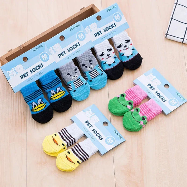 Pack of pet socks featuring cute dog and cat designs in various colors like black, blue, and pink.